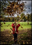 Megan Throwing Autumn Leaves